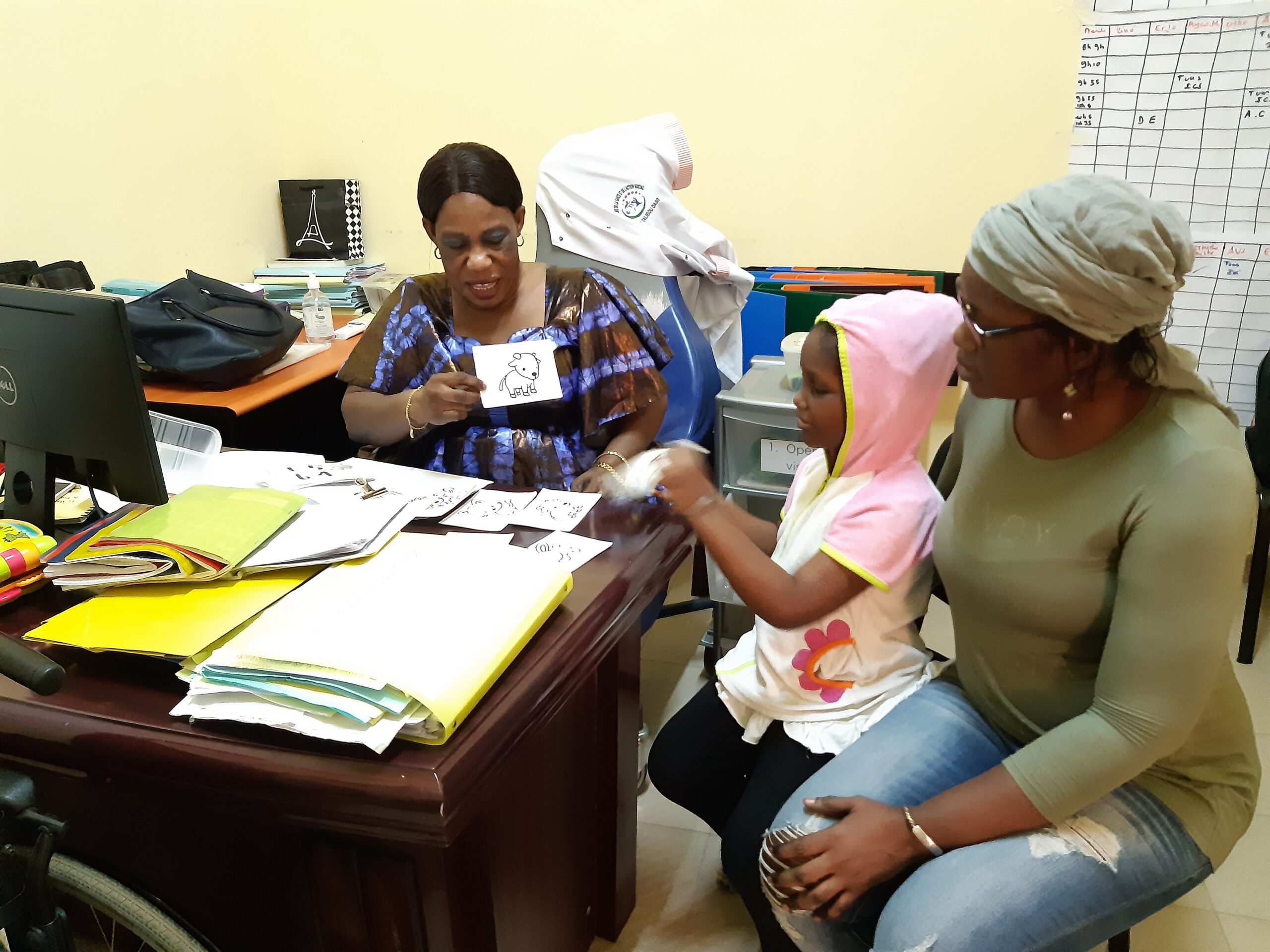 Ndeye performing a screening with the Nozomi Clinic test