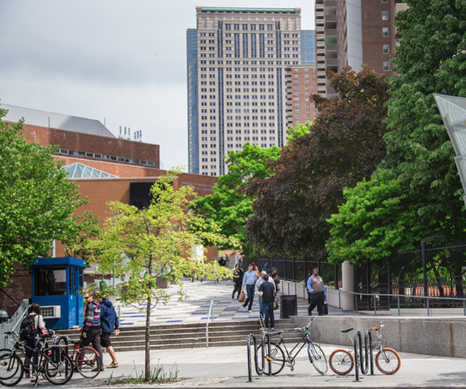 View of Community College campus with students walking on and through the campus.