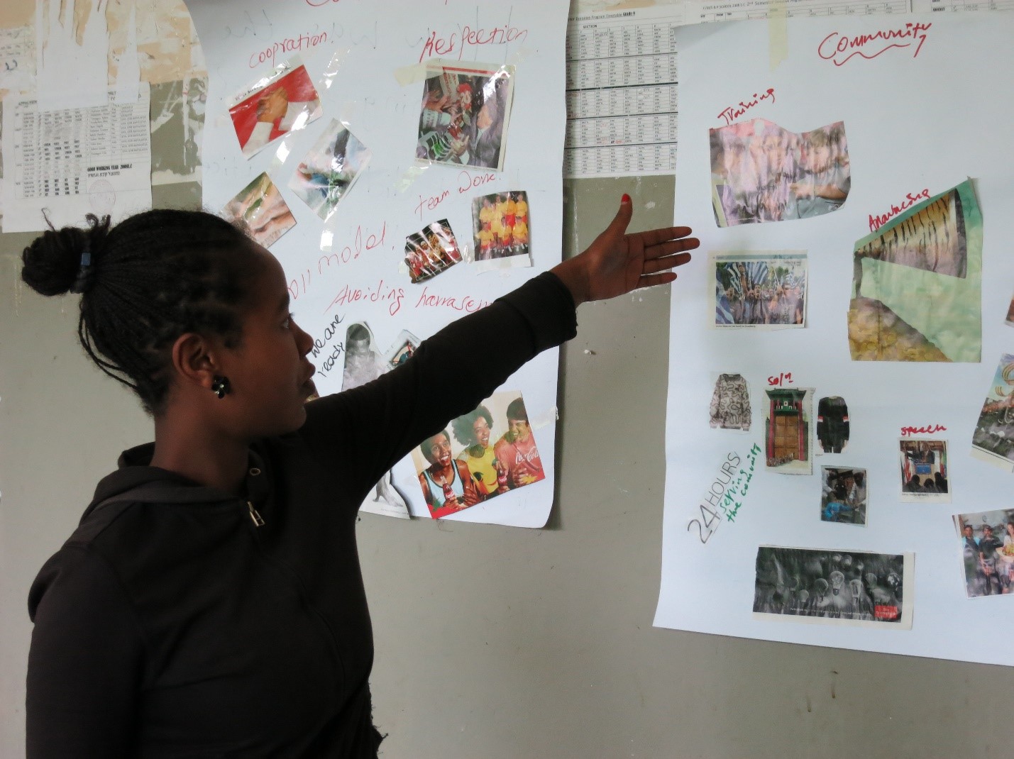 HER graduating student presenting her group's poster on community impact of the HER program, July 2016