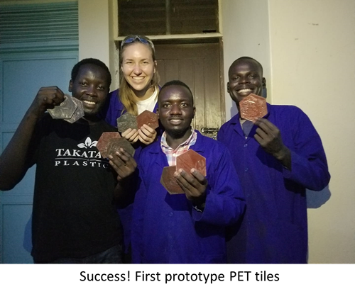 Four Takataka Plastics workers show off their prototype PET tiles