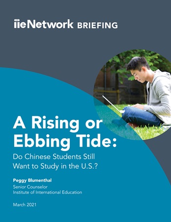Teal report cover with picture of male Asian student working on laptop outdoors