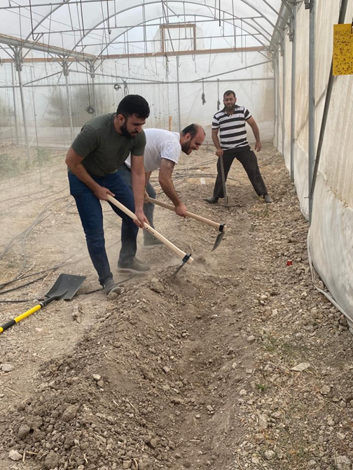 Part of the hands-on training on constructing the raised beds (a sustainable farming practice)