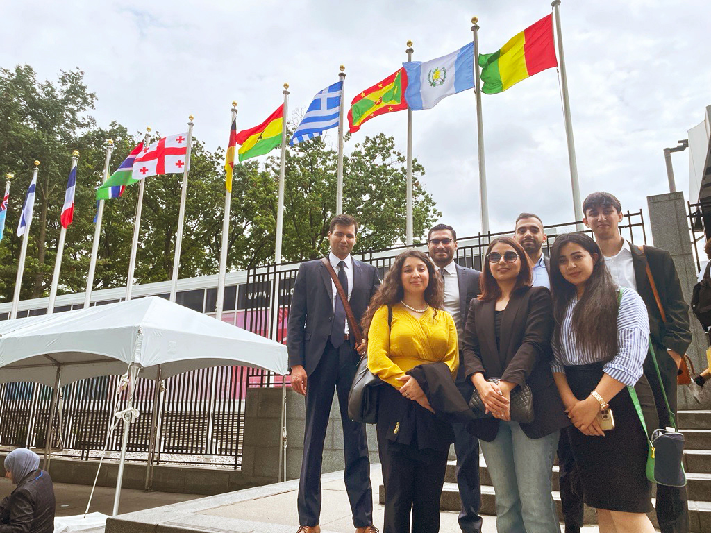 QSAP Scholars gather outside the entrance of the United Nations to attend an event commemorating the fourth anniversary of the Day to Portect International Education from Attack.