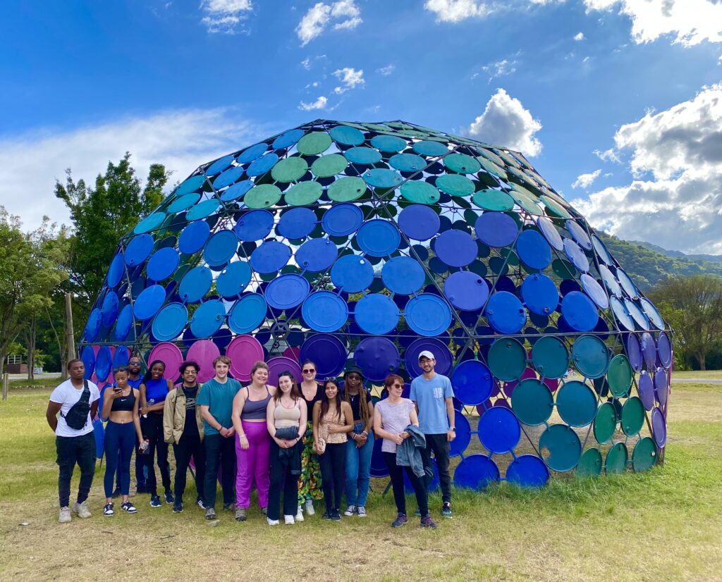 Group of students in front of colorful dome-shaped structure
