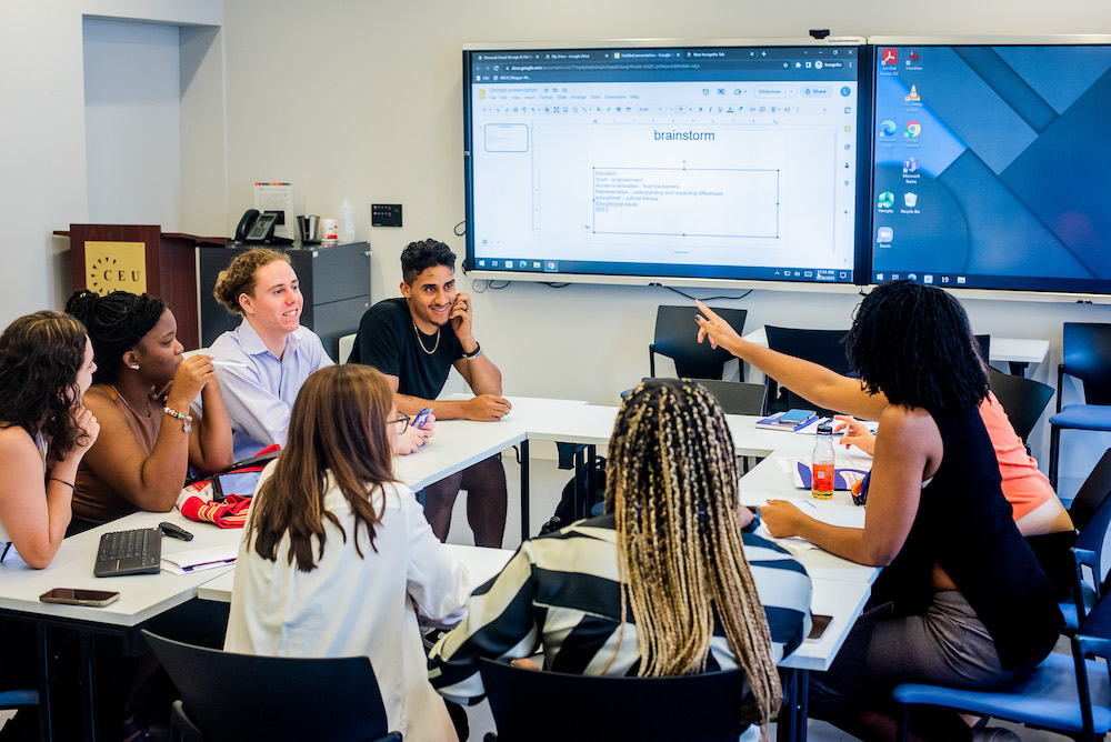 group of students in a classroom engaging in dialogue