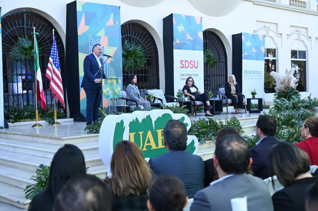 RE:BORDER Conference speakers on stage